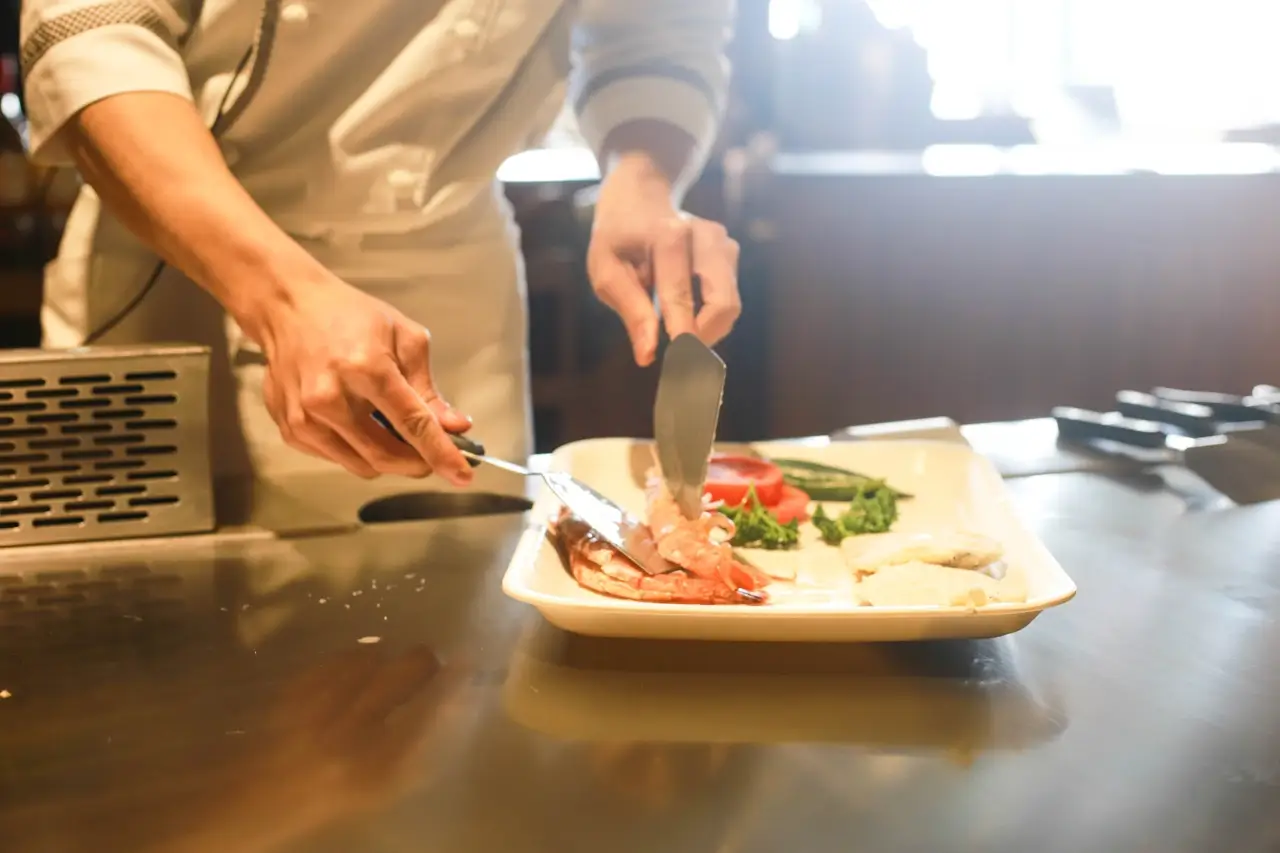 A young person preparing a meal in the food technology kitchen