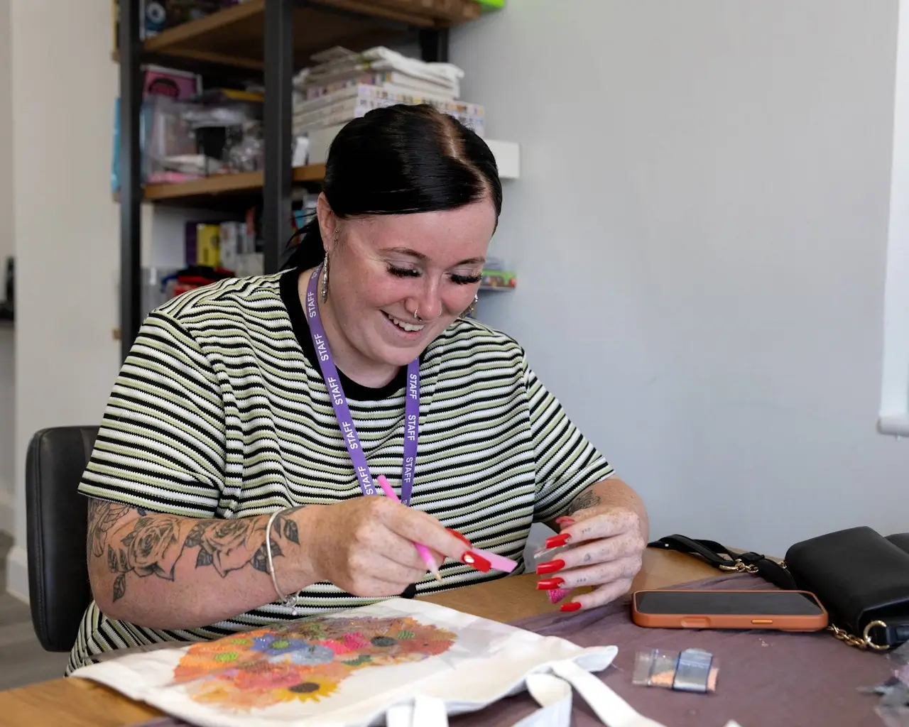 A young person working on a practical craft project at a table