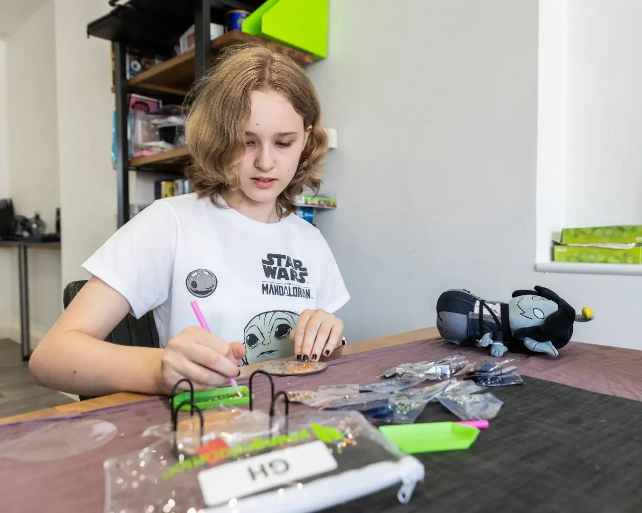 A YoungEducation instructor demonstrating a practical skill to a small group