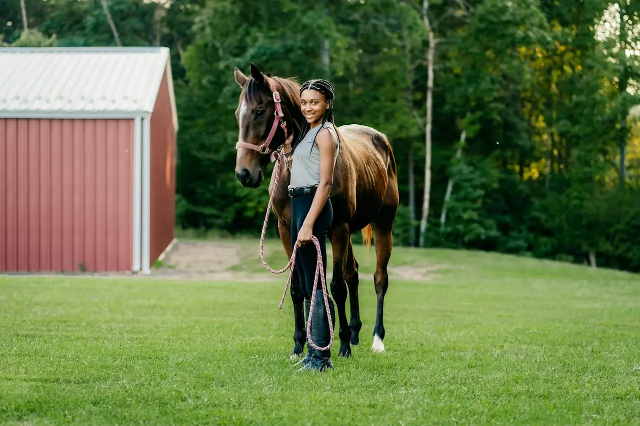 A young person leading a horse during a therapeutic equine session at YoungEducation